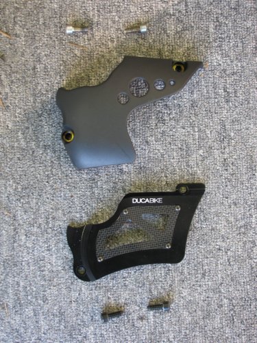 Top is stock, bottom is the Ducabike unit with carbon-fiber insert.
