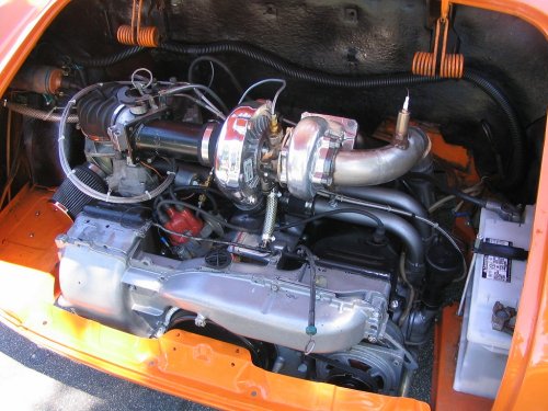 A turbo'd, Type 4 engine in a bright orange Ghia.
