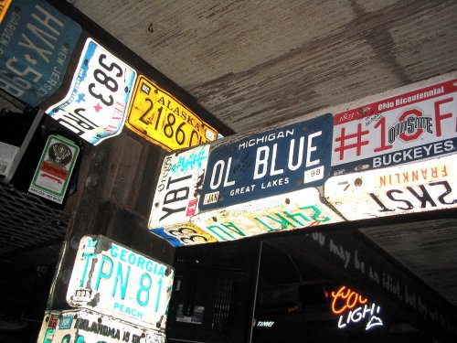 A few of the many license plates on the ceiling at Bubba Gumps.
