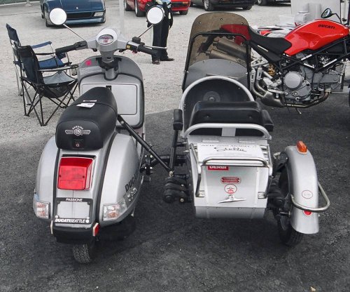 Stella scooter with sidecar.

