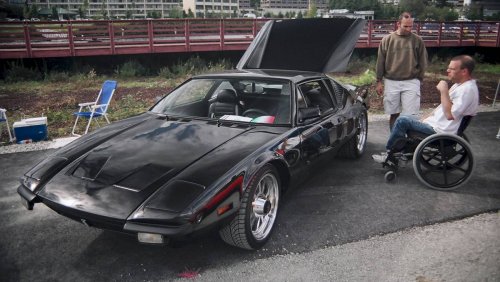 '72 DeTomosa Pantera.  The gentleman in the wheel chair is the owner.  The car is equipped with hand controls.
