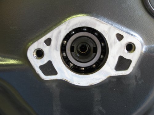 Remove the center cover on the left side to expose the end of the crank.  This is what you'll see.
