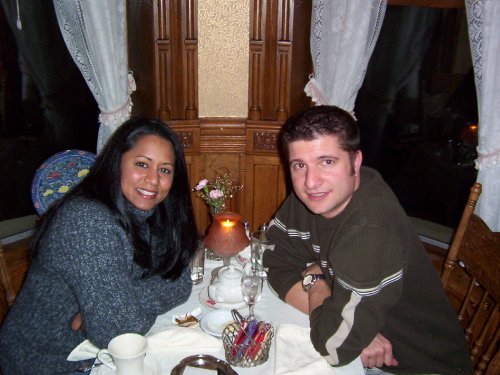 Enjoying a really good dinner together in a little nook.
