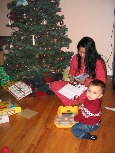 Psst!  Dad!  Tell Mommy to hurry up with the instructions so I can play with my toy.
