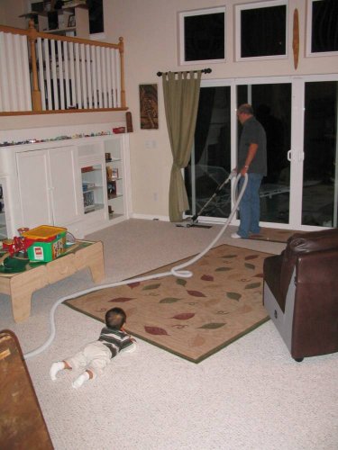 Karl showing Ronin how to vacuum.
