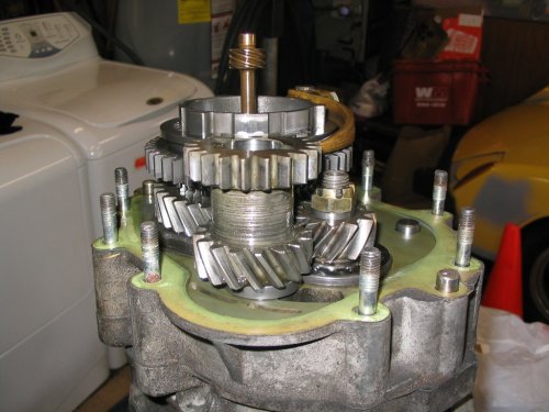 This is what I saw when on the tanny end when I removed the tail cover.  That dumbbell looking gear stack directly in front is what goes on the shaft that is inside the tail cover.
