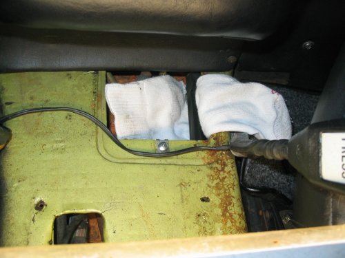 I put a rag under the cabin shift rod to make it easier to maneuver when I had to put it back into the firewall bushing.  Not really necessary if you have skinny fingers like me.
