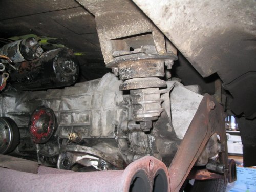 Because I had to swap tail covers, I removed the tranny mounts completely from the body.
