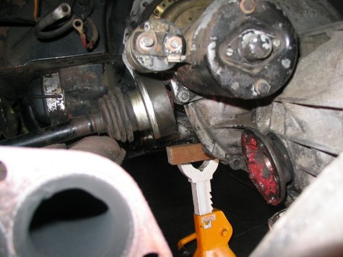 The left side is a pain in the neck, getting the CV past the starter, but mostly because it's greasy and just slows down the process as you wiggle back and down, back and down...
