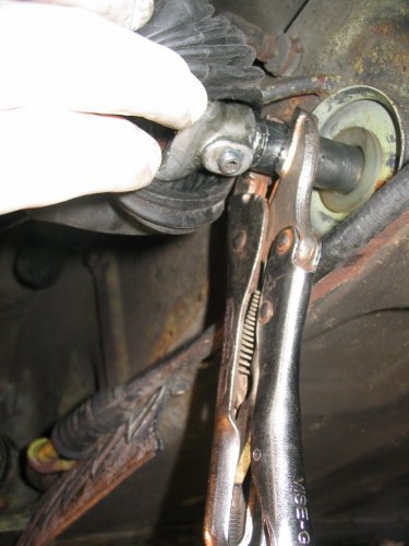 New firewall shifter bushing installed (soak in BOILING HOT WATER for ~30-60 seconds, place in hole, put a 24mm socket against it, and hit with hammer).  The vice-grips [b]greatly[/b] helped get the cabin shift rod into the under-engine shift rod joint.
