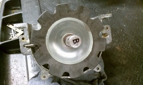 The repaired pin in place.  Thin plastic washer goes between the gear (front and rear gears) and the case.

