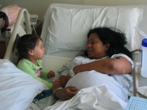 Mommy talking to Bella about her new brother.
