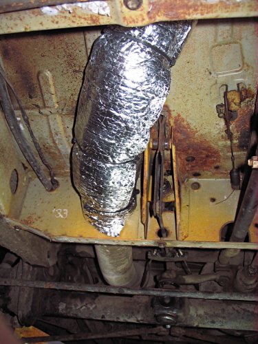 Under the pedal area.  The section behind it isn't insulated yet...
