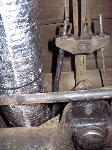 Use a split-seam wire loom around the e-brake cable to keep it from rubbing a groove into the insulation.
