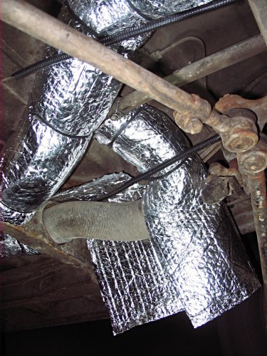 Notice that I put a length of split-loom over the cable and wrapped the insulation over it.  Again, the split-loom keep the cable from cutting into the insulation.
