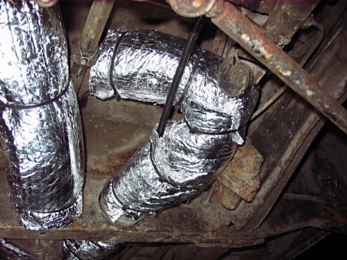 I put a scrap piece of insulation (that I removed from the corner) under the split-loom to fully cover the duct.
