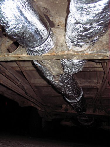 This is a view -- looking to the front of the Bus -- of the dreaded "Y" section where the heat exchanger ducts merge to the center tunnel duct.
