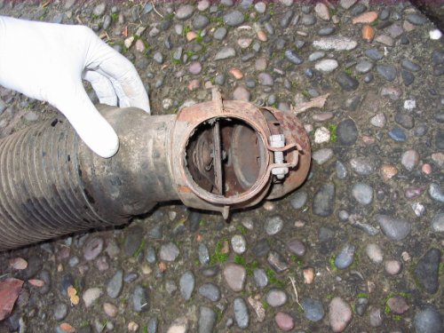 Here is the flapper box that sits above the heat exchangers.  This is the closed position so all air exits out the "bell" (right-most part of the flapper box) and into the atmosphere.  Air is always flowing through the heat exchangers -- it just goes into the interior or vents to the outside.
