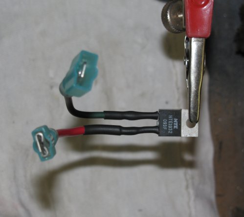 What I did was take a short piece of wire and solder it to the pin on the VR and then shrink-wrapped it to keep it insulated.  I then crimped a spade connector at the end of the wire.  I have a quality (a.k.a. expensive) wire crimper so I know my crimps are good and will last.  The right pin (red wire) of the VR connects to the right spade/tab on the fuel gauge.  The left pin (black wire) is what gets the +12 volts.  Note the spade connetors are being used -- the red wire has a female spade connector and connects to the fuel gauge while the black wire has a male spade connector and is connected to the +12 volt black wire from the gauge cluster.
