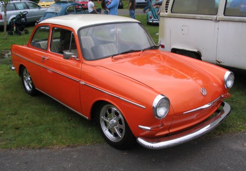 Orange-metalic paint.  Nice looking Notchback.

