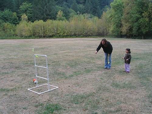 Susan showing Bella how to play some funky game.  Actually, it is challenging.
