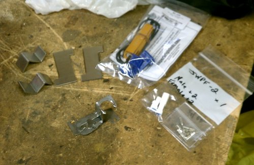 My test bracket front an center proved the load resistor worked in keeping the right LED turn signal from flashing fast when engine RPM went above 3000.  JST 2-prong electrical terminals and 50W, 6-ohm resistors (one per bulb).
