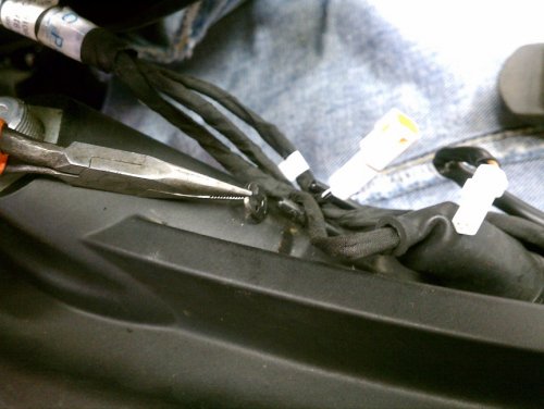 Removing the one-way retaining washer is a pain in the butt.  Chances are very good that you could end up breaking the pin...not that it's a big deal if that happens, honestly.  I did this on the left side to remove the turn signal electrical connector away from the rest of the harness, then pushed the retainer back on.
