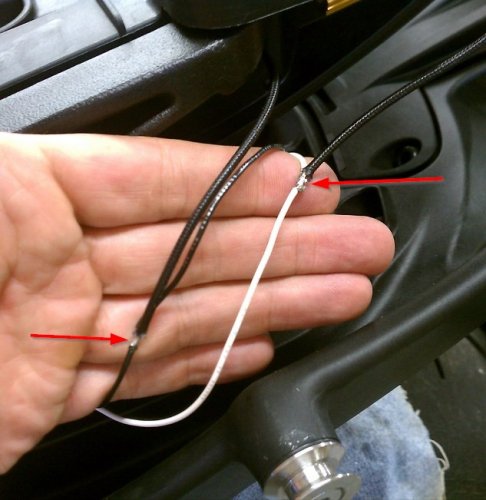 I made a pigtail bridge, effectively just lengthening the distance between the original electrical plugs. This allows me to put the resistor into the circuit, in parallel. This tricks the ECU into thinking it's running incandescent bulbs & thus keeps it from rapidly flashing (bulb-out warning). I was successful on the right side with using blue splice/snap-lock connectors. The left side it wasn't working so I ended up soldering the resistor leads directly to the bridging wires. Perfect. In hind-sight I should've done this to the right side...oh well, some other day. Coated with liquid electrical tape & then wrapped in real tape.
