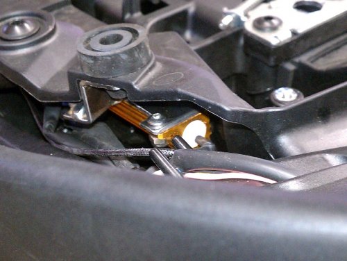 The left side mounted.  The wiring of the pigtail and such was all pushed forward, thus being outside of the seat pan just like the resistor.  The pigtail length was 15cm and that gave plenty of slack to add the resistor leads to.
