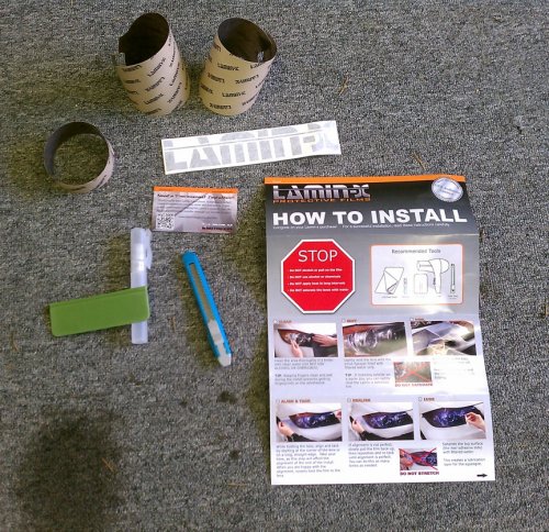 Comes with everything you see here, including a knife for trimming excess film off and a [u]very[/u] nice water mister.  Follow the instructions!  I did use the sharp knife to trim the mounting tabs off (they're only used for positioning the film).  I placed the film closest to the inside edge of the lens (near the center of the headlight) to get the best coverage.
