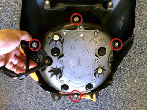 Remove these four bolts (4mm Allen) to free the headlight from the headlight fairing.
