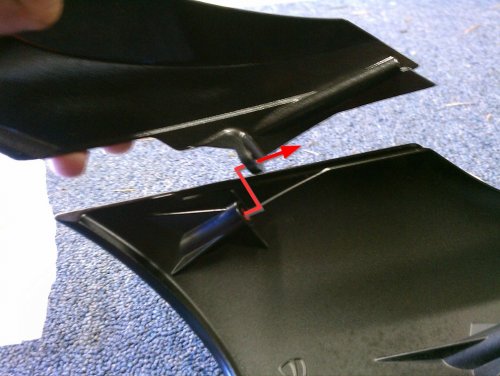 Shows how the top and bottom parts of the headlight fairing join.
