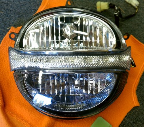 Bottom covered, LED and top uncovered.
