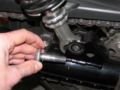 Lower bolt.  Use a 10mm Allen wrench to remove the bolts.  Though they already have molyb (grease B using Ducati nomenclature) smeared on them I (later) added a little bit more.
