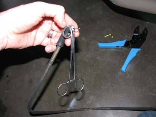 Slipping the boot past the end of the wire can be a little tricky so hemostats are helpful in pulling.  Remember to use some WD-40 to help lubricate the wire.  The blue crimpers have an MSD die in them for crimping the connectors to the wires. 
