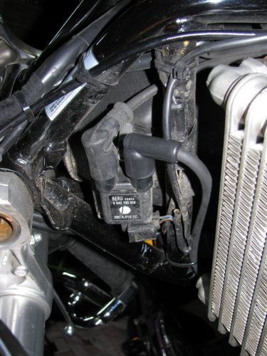 The front coil.  The dull black one to the left is the original Ducati plug wire and my new one is on the right.
