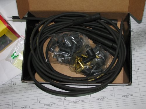 A look inside.  Two styles of 90-degree plugs and connectors.  The 180-degree ends are already on the ends and ready for use.
