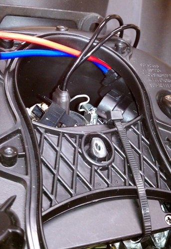 First zip-tie installed.  I waited on the second one so I could move the ballast a little while working on the electrical cabling.  This just helps get the ballast out of the way and keeps it from moving around too much.  You can now install the HID bulb and secure it.
