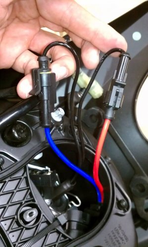 Connect the ignitor wires to the bulb.  One thing I did to make this wiring install easier is to remove the weather seal that holds the 4 wires.  Since everything is contained within the headlight bucket there's no need for the wiring seal.  Carefully use a sharp blade, like a crescent X-acto blade, to cut the seal and remove the wiring.
