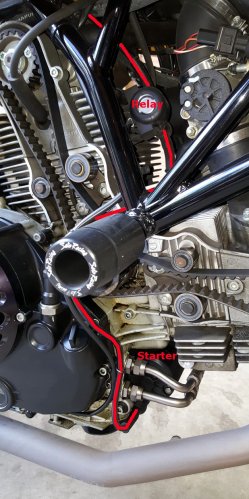 The OEM setup.  The red line is the stock power cable that comes from the battery to the relay, down the right side of the engine, and under the engine to the starter.
