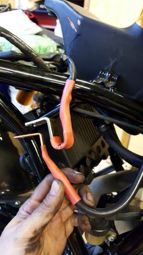 Here is the end result of my custom work.  The copper tab is fairly easy to bend so I tweaked it just a tad to fit with the OEM tab.
