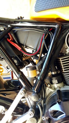 This shows the end product.  The brown line is the new Motolectric ground cable that pretty much follows the OEM path.  The red line is the new Motolectric power cable for the starter circuit.  I routed the new Motolectric cable along the OEM path along the upper frame.
