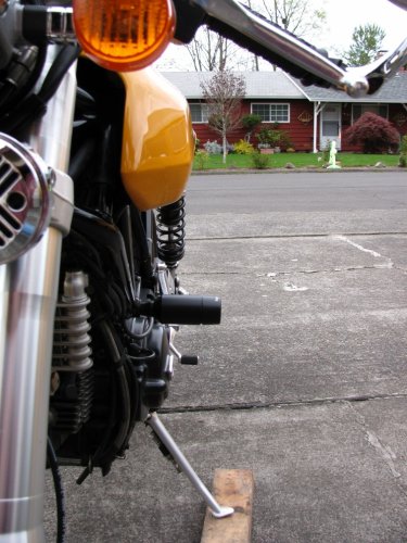 Frame slider.  I lined up the edge of the tank to the edge of the rear seat to show how far it sticks out.  In person it's really not that bad.
