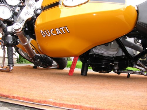 I put a yard stick inbetween the gaps to show the distance of the tank to the ground.  Just under 5" (five inches).  That's pretty good space and if you get a leg stuck it could save that as well.
