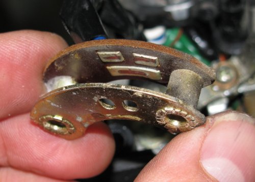 The female part of the sliding switch for the high/low beam switch.  The long pad is the common power and the right pad is low beam, the left pad is high beam (as pictured here).
