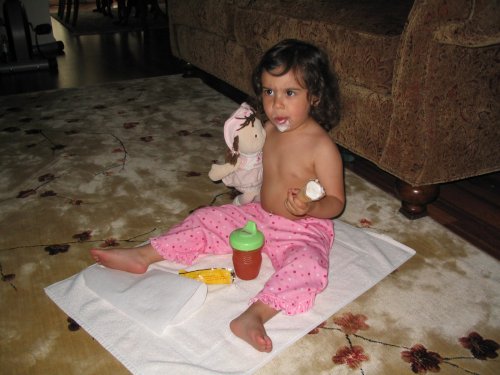 Li'l Monkey eatting ice cream and watching TV.

