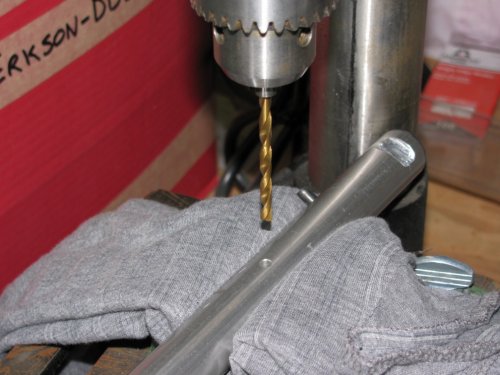 It seems that the locating pin on the '06 throttle clamp is 180-degrees off compared to later models.  The fix was simple:  Use a 5/32" drill bit and drill straight through the existing hole.  Easy-peasy!
