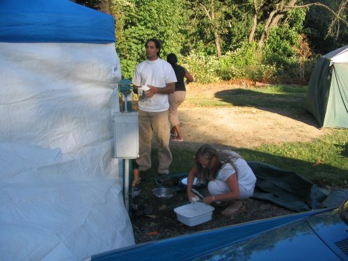 Frank, Antonette (background) and Heather washing dishes.
