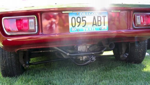 The linkage was literally inches from the ground and crude in comparison to Porsche's.  The shift linkage arched over the open universal joint axle.
