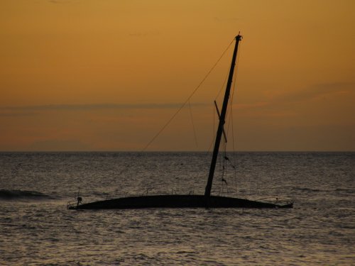 Same boat, just with the sun setting around it.  Picture taken from the park.
